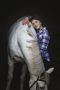 Northamptonshire girl hugging her pony