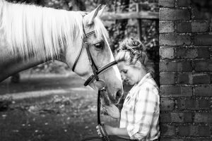 Equestrian and her horse photographed in a garden in Northamptonshire