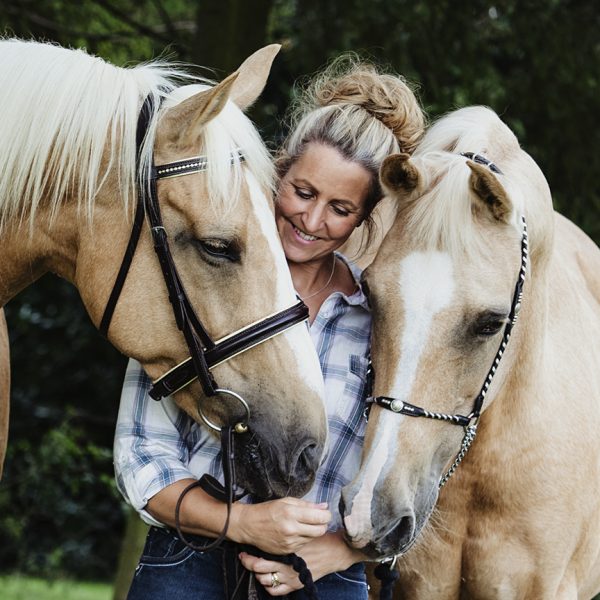 Northamptonshire rider snuggles in with her two palimino horses